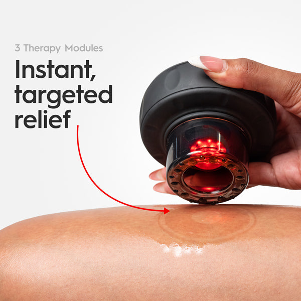 REVO cupping massager showing integrated red light during use